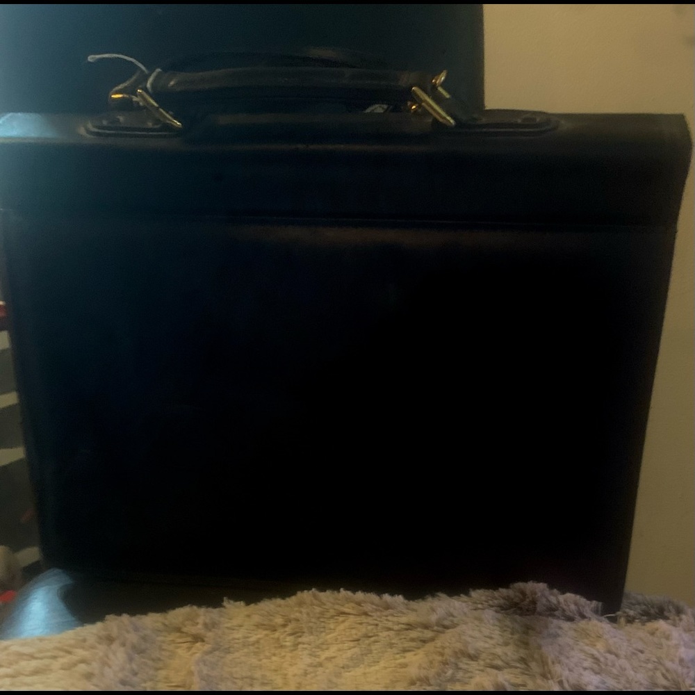 Leather briefcase/Laptop bag. Has key and lock